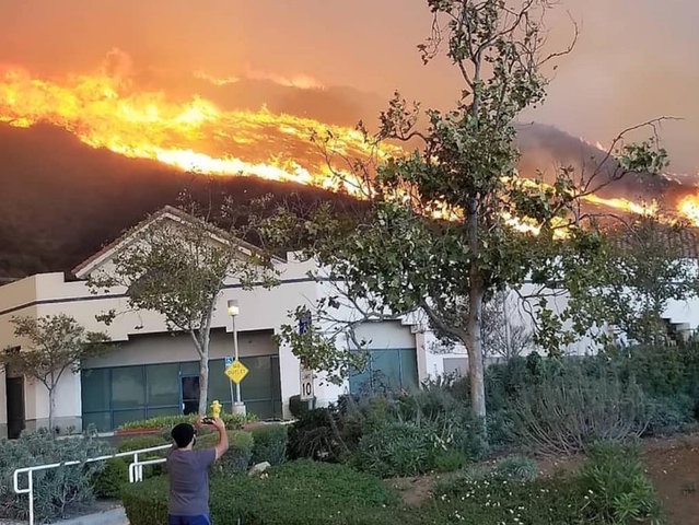 Down the road from mass shooting, people are being evacuated because of a wildfire